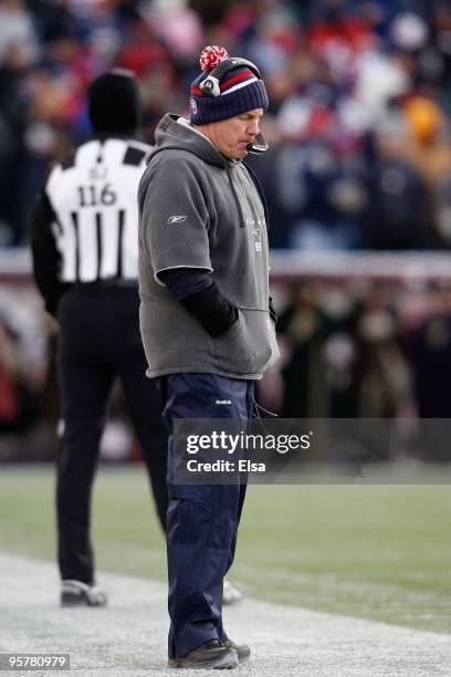 Head coach Bill Belichick of the New England Patriots stands on the sideline with his head down against the Baltimore Ravens during the 2010 AFC...