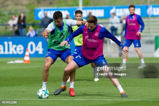 Franco Di Santo of Schalke and Bastian Oczipka of Schalke battle for the ball during a training session at the FC Schalke 04 Training center on April...