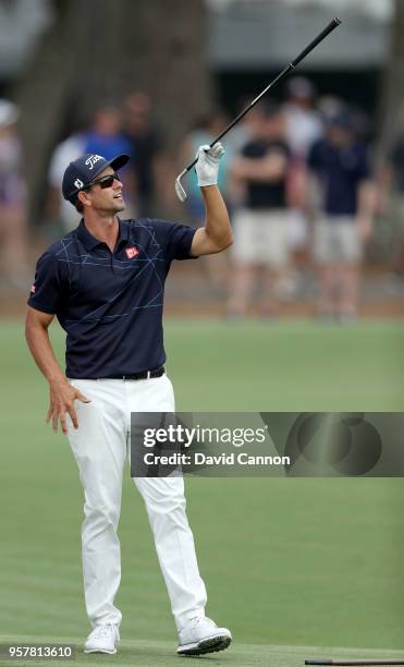 Adam Scott of Australia prepares to play his second shot on the par 4, 15th hole during the third round of the THE PLAYERS Championship on the...