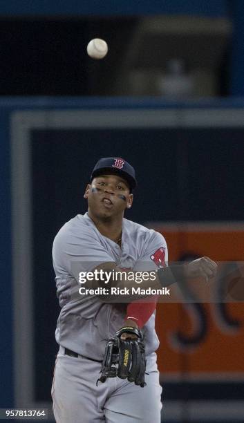 Boston Red Sox third baseman Rafael Devers turns a simple play into a throwing error allowing the Jays to reach base late in the game. Toronto Blue...