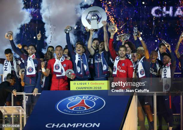 Thiago Silva and Thiago Motta of PSG surrounded by teammates Javier Pastore, Layvin Kurzawa, Alphonse Areola, Thomas Meunier, Kevin Trapp, Julian...