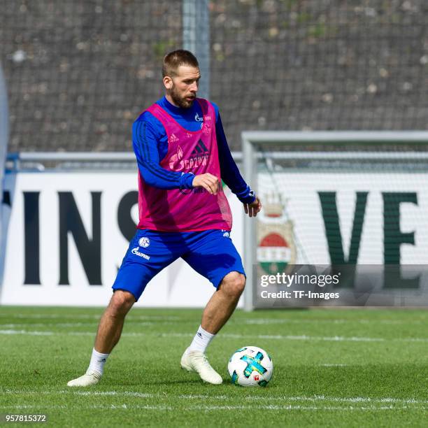 Guido Burgstaller of Schalke controls the ball during a training session at the FC Schalke 04 Training center on May 2, 2018 in Gelsenkirchen,...