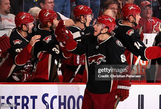 Peter Mueller of the Phoenix Coyotes celebrates with teammates after scoring a goal during the NHL game against the New York Islanders at Jobing.com...