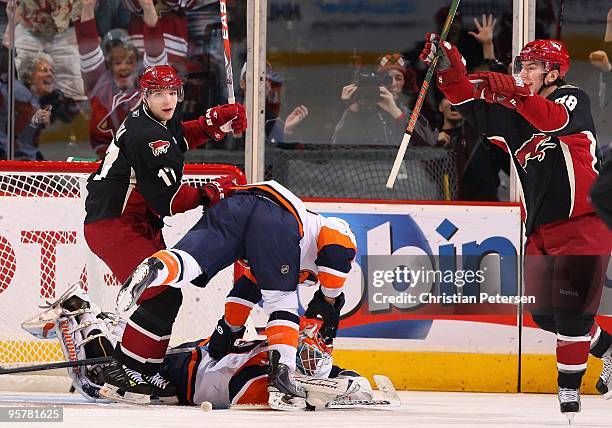 Peter Mueller of the Phoenix Coyotes celebrates with Radim Vrbata after scoring a goal during the NHL game against the New York Islanders at...