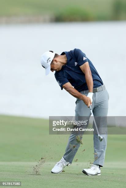 Xander Schauffele of the United States plays his second shot on the par 4, 18th hole during the third round of the THE PLAYERS Championship on the...