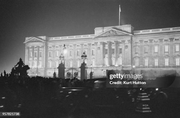 Crowds outside a floodlit Buckingham Palace on the wedding day of Princess Elizabeth and Philip Mountbatten, Duke of Edinburgh, London, 20th November...