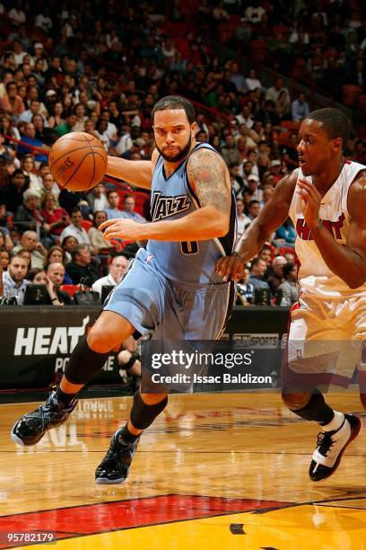 Deron Williams of the Utah Jazz moves the ball against Mario Chalmers of the Miami Heat during the game on December 23, 2009 at American Airlines...