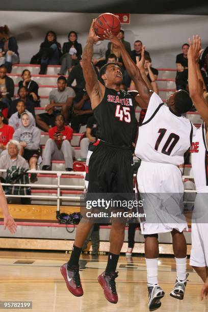 Charles Garcia of the Seattle Redhawks shoots against Tony Osunsanmi of the Cal State Northridge Matadors on January 11, 2010 at the Matadome in...