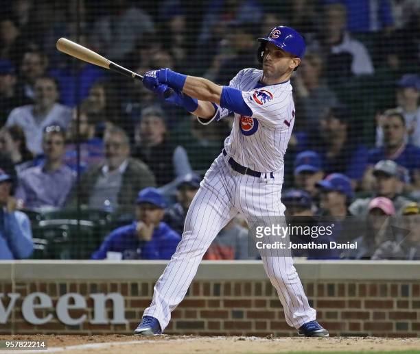 Tommy La Stella of the Chicago Cubs bats against the Miami Marlins at Wrigley Field on May 7, 2018 in Chicago, Illinois. The Cubs defeated the...