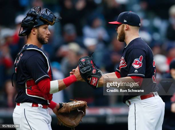 Cody Allen of the Cleveland Indians and catcher Yan Gomes celebrate a 6-2 victory over the Kansas City Royals at Progressive Field on May 12, 2018 in...