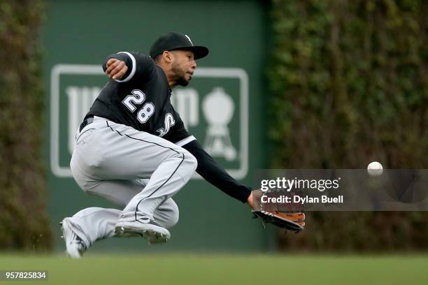 Leury Garcia of the Chicago White Sox attempts to catch a fly ball in the first inning against the Chicago Cubs at Wrigley Field on May 12, 2018 in...