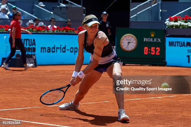 Ekaterina Makarova of Russia in action during the match between Timea Babos of Hungry and Kristina Mladenovic of France during day eight of the Mutua...