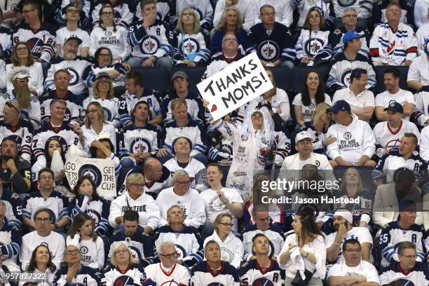 Fan holds a sign for mothers day during the first period in Game One of the Western Conference Finals between the Winnipeg Jets and the Vegas Golden...