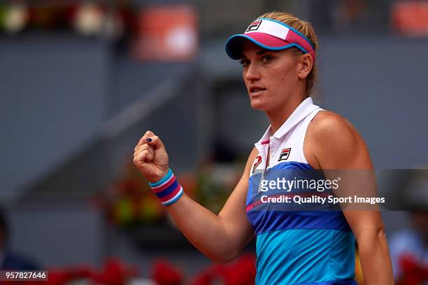 Timea Babos of Hungry reacts during the match between Ekaterina Makarova and Elena Vesnina of Russia during day eight of the Mutua Madrid Open at La...