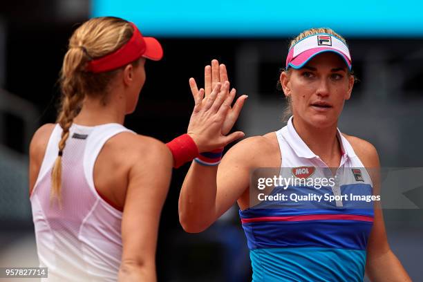 Timea Babos of Hungry and Kristina Mladenovic of France during the match between Ekaterina Makarova and Elena Vesnina of Russia during day eight of...