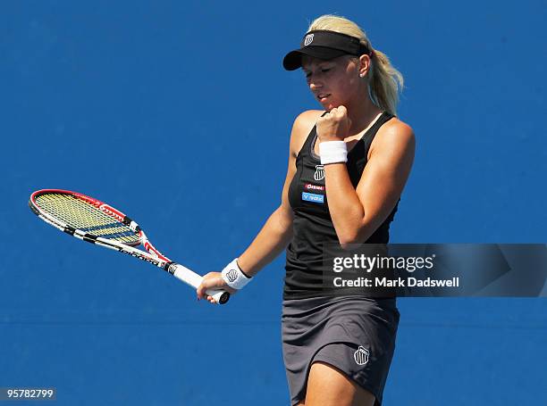 Michaella Krajicek of the Netherlands celebrates winning the first set in her Women's Qualifying second round match against Laura Robson of Great...