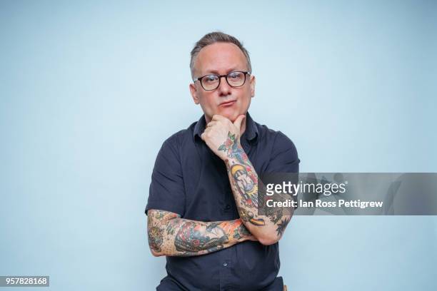 portrait of middle-aged man with tattoos - arm tattoos for black men fotografías e imágenes de stock