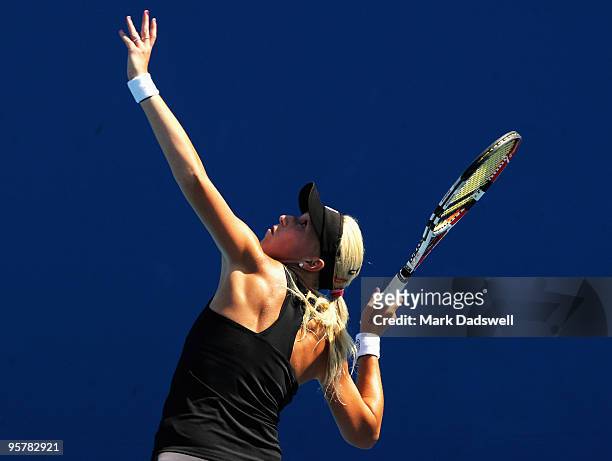 Michaella Krajicek of the Netherlands hits a serve in her Women's Qualifying second round match against Laura Robson of Great Britain ahead of the...