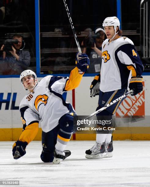 Steve Montador watches as Patrick Kaleta of the Buffalo Sabres celebrates after scoring a goal against the Atlanta Thrashers at Philips Arena on...