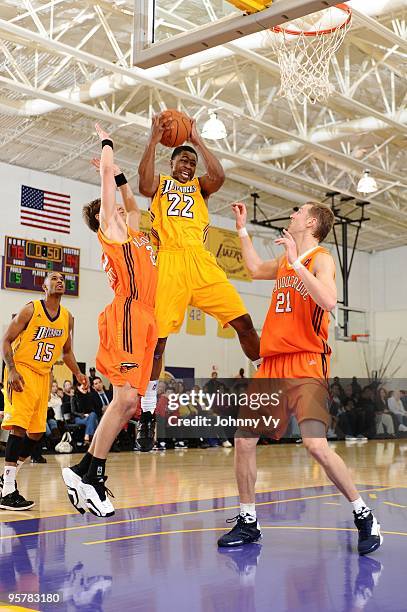 Dar Tucker of the Los Angeles D-Fenders rebounds against Chad Toppert and Yaroslav Korolev of the Albuquerque Thunderbirds during the game at Toyota...