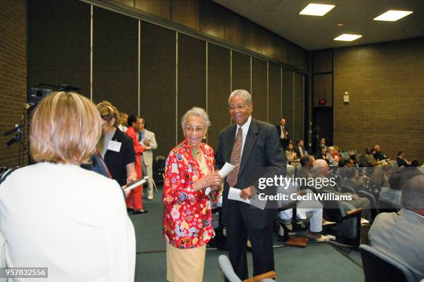 At a Civil Rights Movement symposium, married couple Hallie Bacote Perry and US Federal Judge Matthew J Perry share a laugh as they are photograph in...