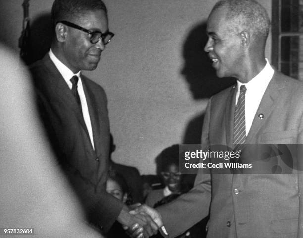 American attorney Matthew J Perry shakes hands with Civil Rights activist and NAACP president Roy Wilkins , Orangeburg, South Carolina, 1960s.