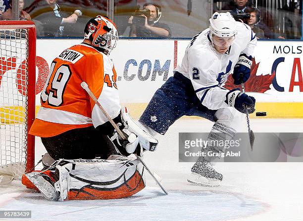 Luke Schenn of the Toronto Maple Leafs is stopped in close by Michael Leighton of the Philadelphia Flyers during game action January 14, 2010 at the...