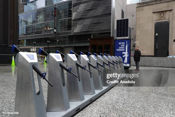 Row of 10 replicas of AR-15 rifles are displayed within the Gun Share Program to draw attention to armament at Daley Plaza in Chicago, United States...