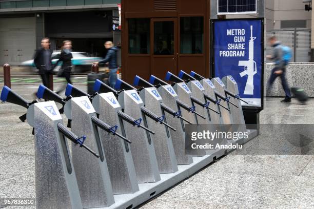 Row of 10 replicas of AR-15 rifles are displayed within the Gun Share Program to draw attention to armament at Daley Plaza in Chicago, United States...
