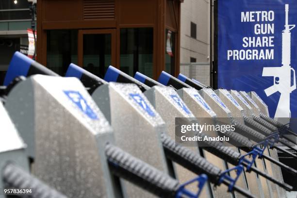 Row of 10 replicas of AR-15 rifles are displayed within the Gun Share Program to draw attention to armament at Daley Plaza in Chicago, United States...