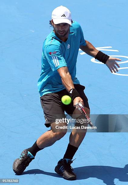 Fernando Gonzalez of Chile plays a backhand in his third round match against Ivan Ljubicic of Croatia during day three of the 2010 Kooyong Classic at...