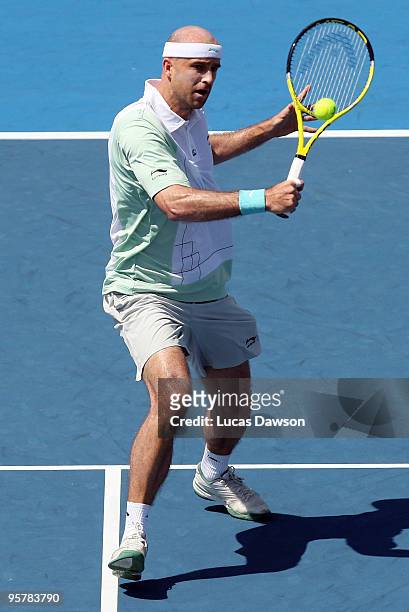 Ivan Ljubicic of Croatia plays a backhand in his third round match against Fernando Gonzalez of Chile during day three of the 2010 Kooyong Classic at...