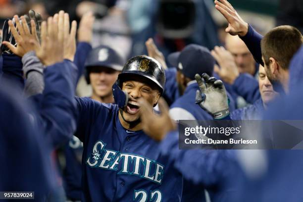 Robinson Cano of the Seattle Mariners celebrates his three-run home run against the Detroit Tigers with teammates during the fifth inning of game two...