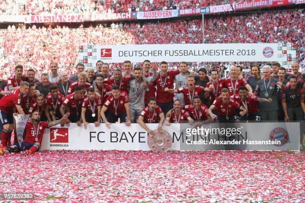 The team of Bayern Muenchen celebrates with the trophy winning the Germany Champiosnhip 2017/2018 after the Bundesliga match between FC Bayern...