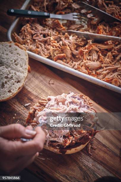 messy pulled pork burger with coleslaw - pickled pork stock pictures, royalty-free photos & images