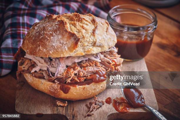 messy pulled pork burger with coleslaw - pickled pork stock pictures, royalty-free photos & images