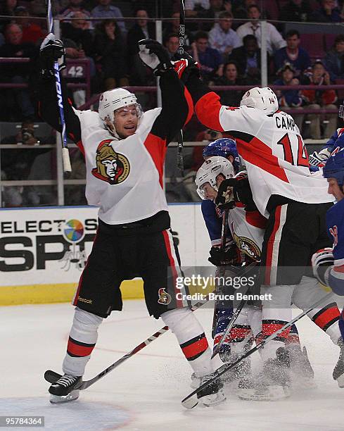 Chris Campoli of the Ottawa Senators scores at 18:46 of the third period against the New York Rangers as Mike Fisher celebrates at Madison Square...