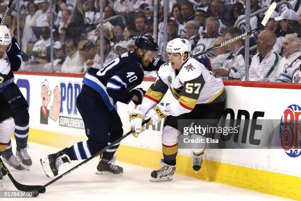Joel Armia of the Winnipeg Jets and David Perron of the Vegas Golden Knights battle for the puck during the third period in Game One of the Western...