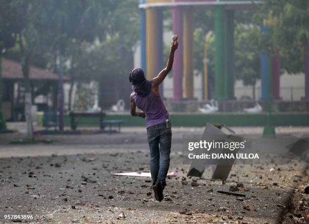 Demonstrators clash with riot police agents during nation-wide protests demanding justice, democracy and the departure of President Daniel Ortega, in...