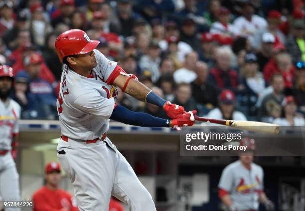 Jose Martinez of the St. Louis Cardinals hits an RBI double during the sixth inning of a baseball game against the San Diego Padres at PETCO Park on...