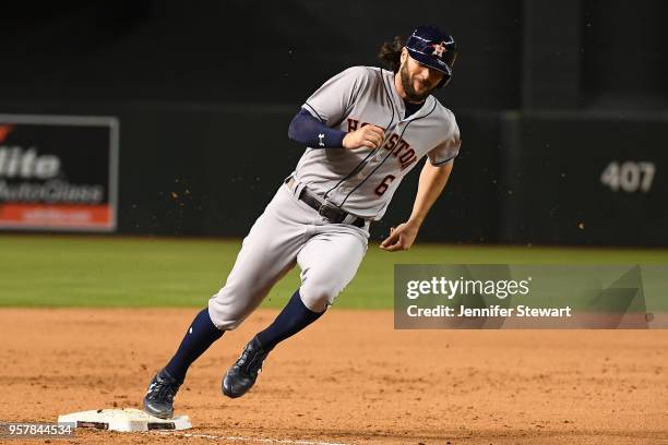 Jake Marisnick of the Houston Astros rounds third base to score against the Arizona Diamondbacks in the eighth inning of the MLB game against the...