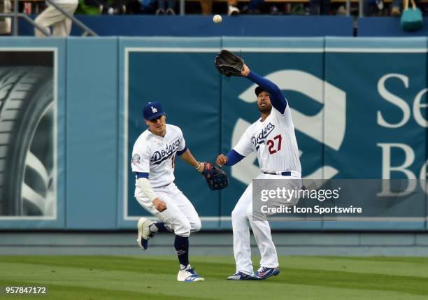 Los Angeles Dodgers Outfield Matt Kemp catches a pop fly in left field while avoiding a collision with Los Angeles Dodgers Infield Max Muncy during a...