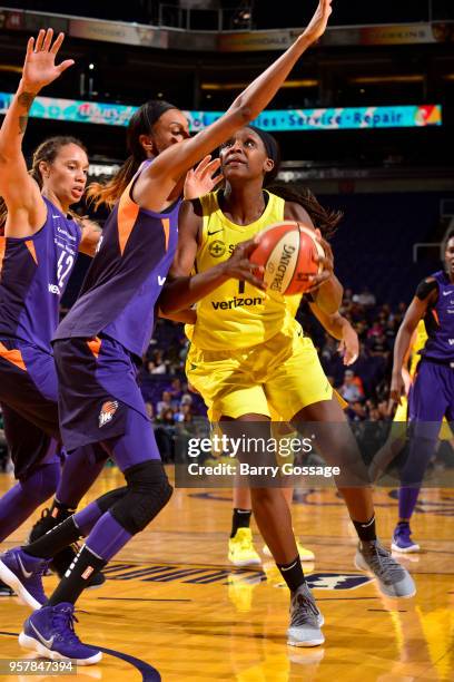 Crystal Langhorne of the Seattle Storm drives to the basket against the Phoenix Mercury during a pre-season game on May 12, 2018 at Talking Stick...