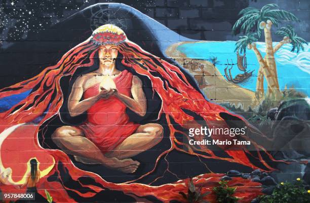 Street art depicts Pele, the Hawaiian goddess of fire, in the aftermath of eruptions from the Kilauea volcano on Hawaii's Big Island, on May 12, 2018...