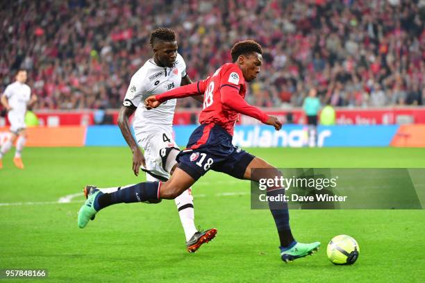 Lebo Mothiba of Lille and Papy Milson Djilobodji of Dijon during the Ligue 1 match between Lille OSC and Dijon FCO at Stade Pierre Mauroy on May 12,...