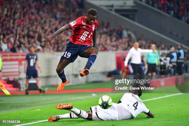 Nicolas Pepe of Lille beats Papy Milson Djilobodji of Dijon during the Ligue 1 match between Lille OSC and Dijon FCO at Stade Pierre Mauroy on May...