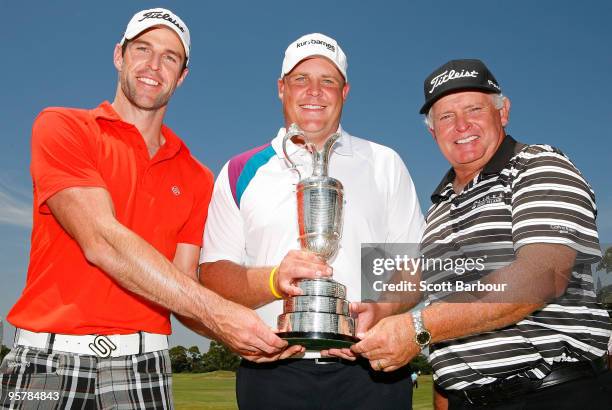 Ewan Porter of Australia, Kurt Barnes of Australia and Peter Senior of Australia pose with the Claret Jug after finishing as the top three qualifiers...