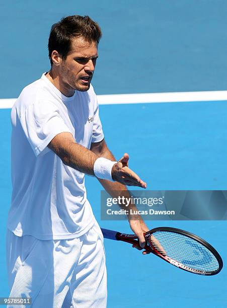 Tommy Haas of Germany talks to a linesmen in his third round match against Jo-Wilfried Tsonga of France during day three of the 2010 Kooyong Classic...