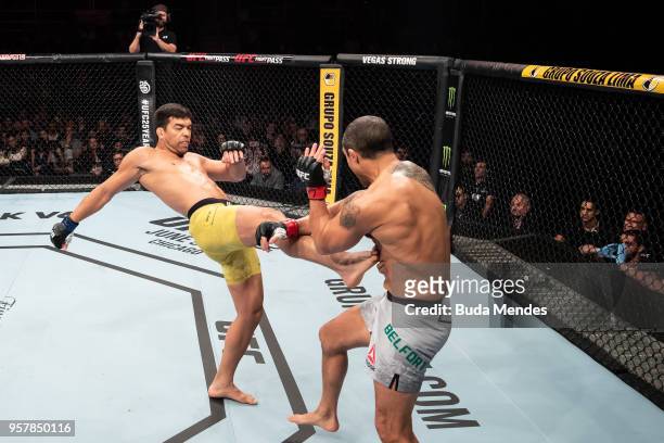 Lyoto Machida of Brazil kicks Vitor Belfort of Brazil in their middleweight bout during the UFC 224 event at Jeunesse Arena on May 12, 2018 in Rio de...