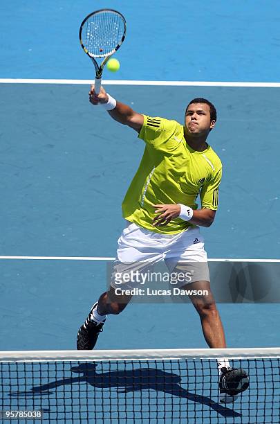 Jo-Wilfried Tsonga of France plays a smash in his third round match against Tommy Haas of Germany during day three of the 2010 Kooyong Classic at...